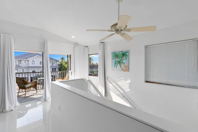 a bathroom with a toilet sink vanity and shower