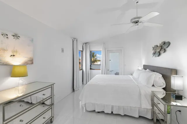 a bedroom with a bed and a lamp