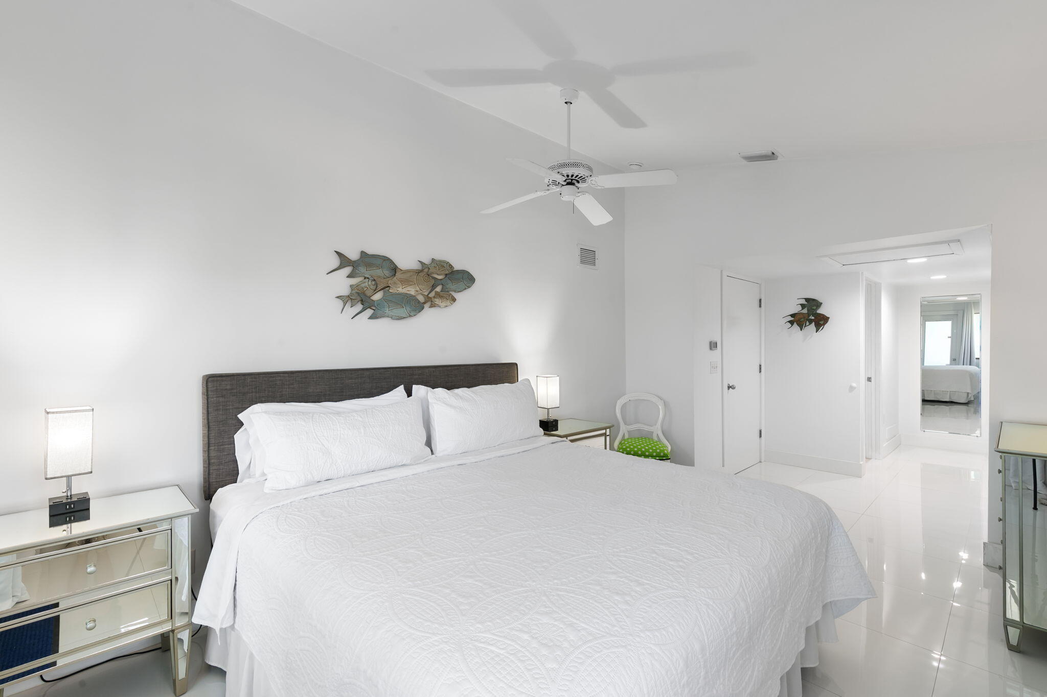 821 Palm Street Marco Island, FL 34145 - Photo 17 of 62 a bedroom with a bed and a lamp