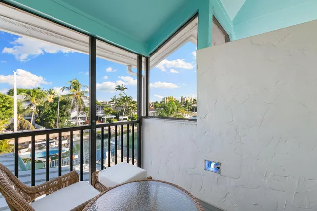 a view of a chairs and table in patio