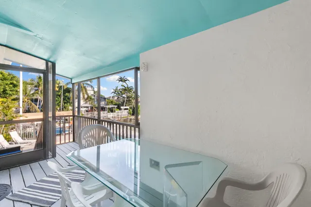 a bathroom with a granite countertop sink a large mirror and a shower