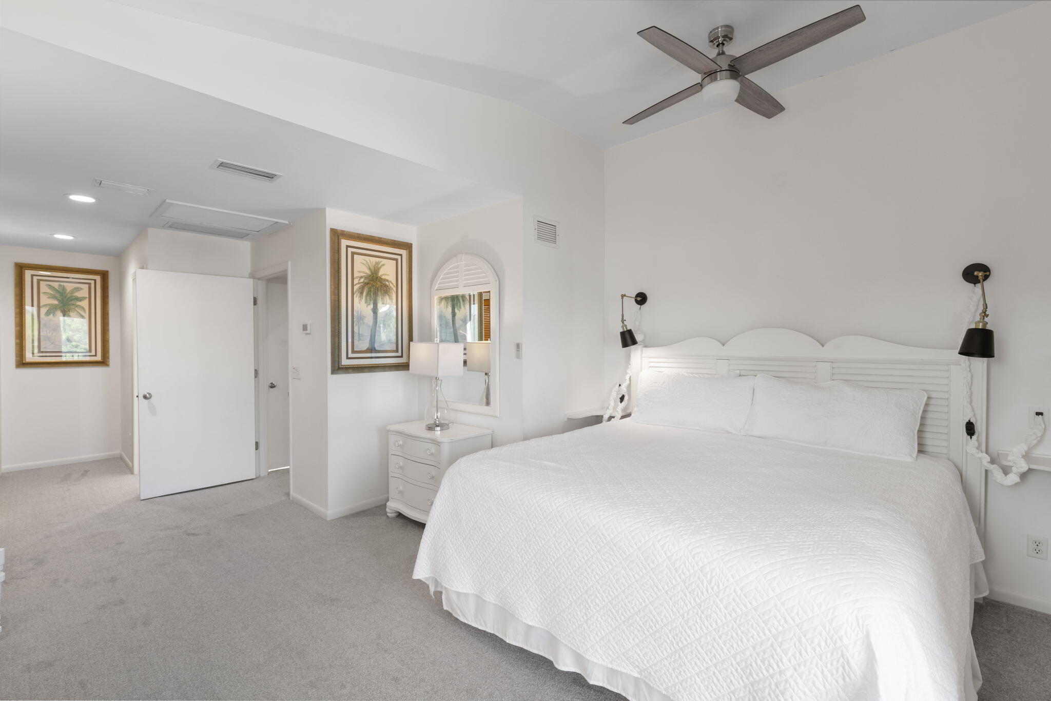 821 Palm Street Marco Island, FL 34145 - Photo 32 of 62 a bedroom with a bed and a chandelier