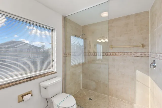 a view of a dining room with furniture a rug and wooden floor