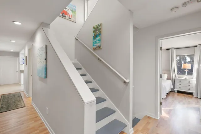 a kitchen with granite countertop a sink stove and cabinets