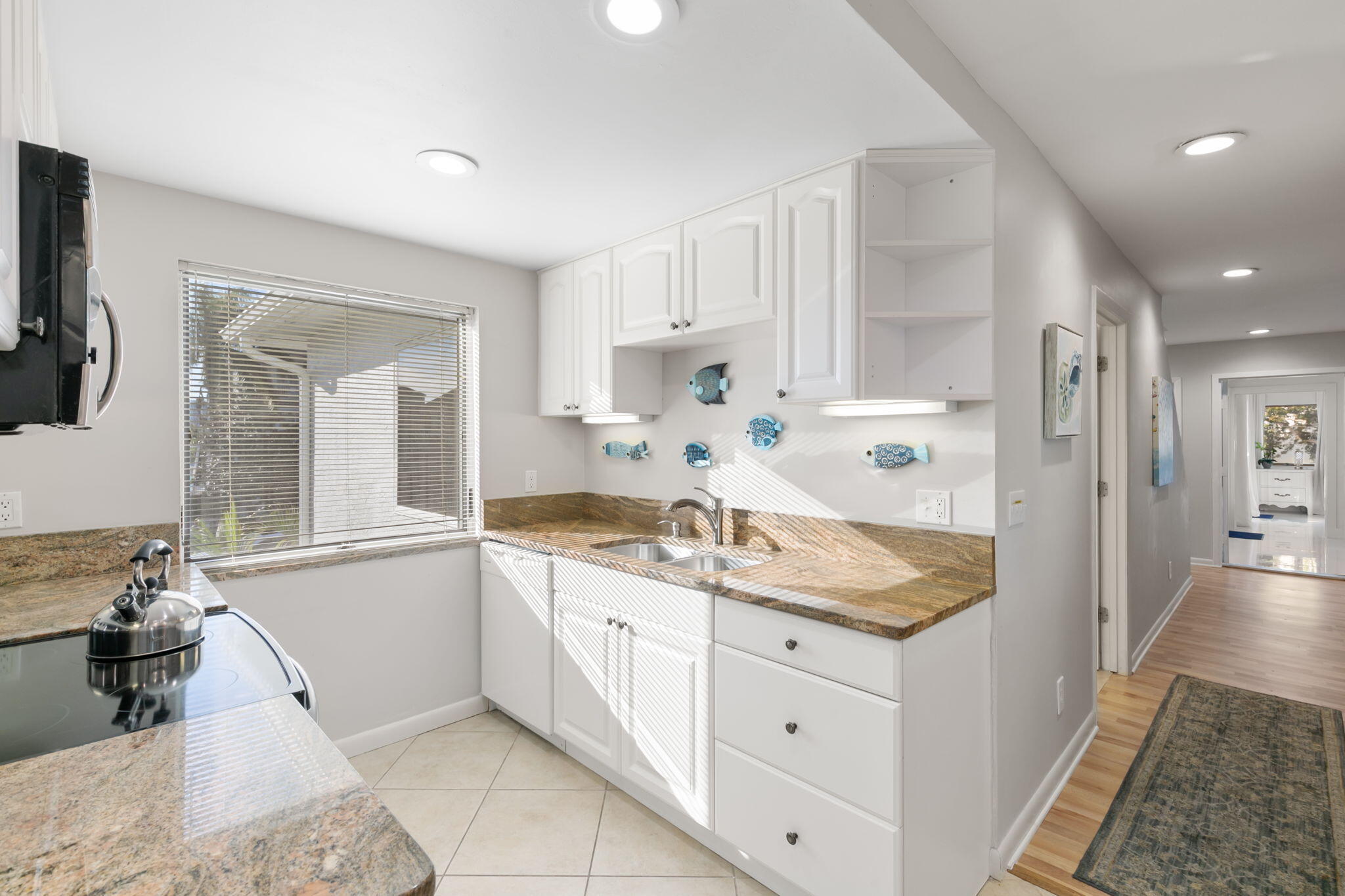 821 Palm Street Marco Island, FL 34145 - Photo 46 of 62 a bathroom with a granite countertop sink mirror and a shower