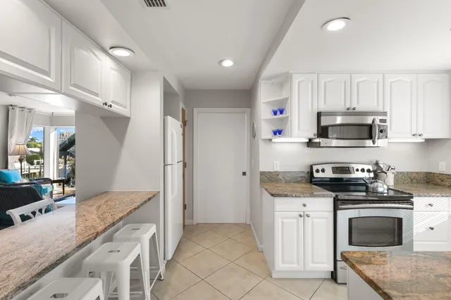 an aerial view of a house with a swimming pool