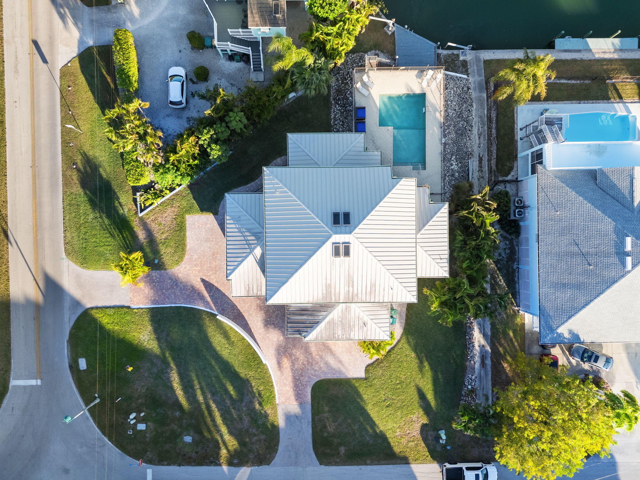 821 Palm Street Marco Island, FL 34145 - Photo 59 of 62 an aerial view of a house with a swimming pool