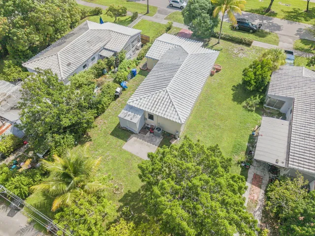 a aerial view of a house with a yard