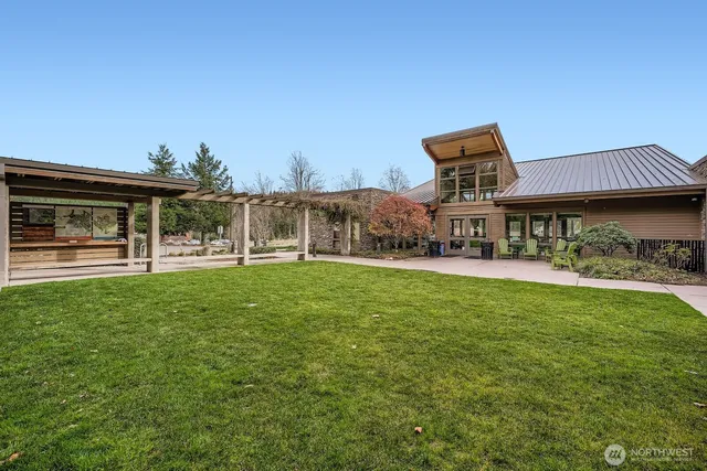 a front view of a house with a yard table and chairs