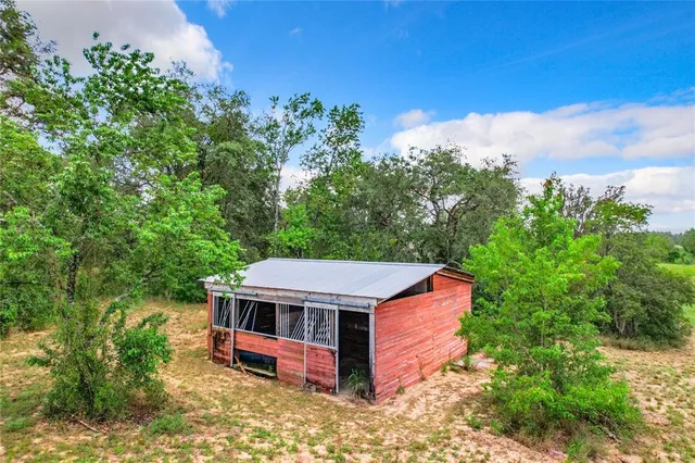 a view of a garden with an outdoor space