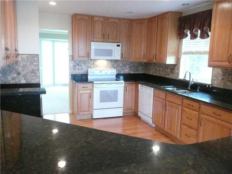 405 Meadow View Drive McKees Rocks, PA 15136 - Photo 8 of 25 Kitchen. NEW GRANITE COUNTER TOPS, TRAVERTINE BACK SPLASH, UPDATED FIXTURES