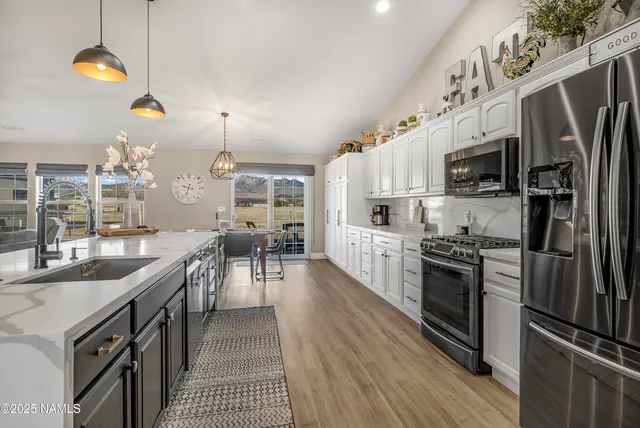 a room with furniture and a potted plant