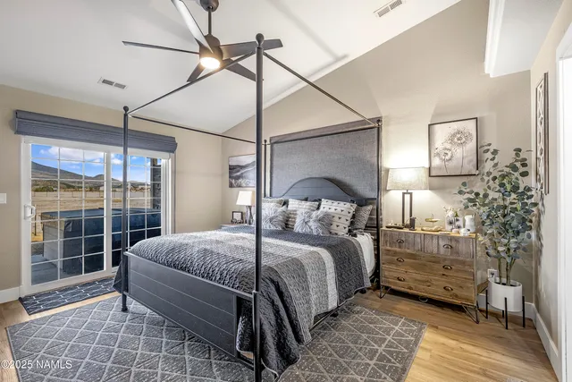 a view of a terrace with lawn chairs