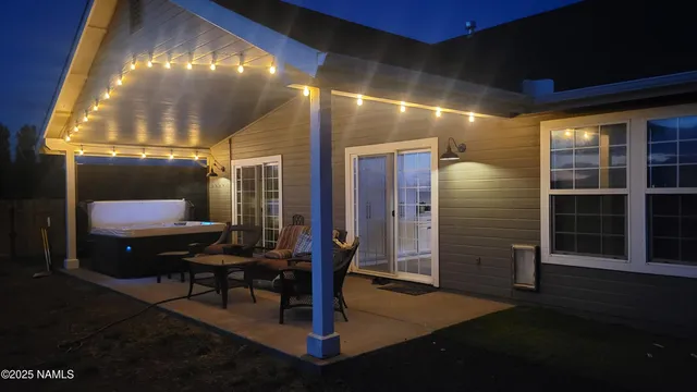 a view of a backyard with a large tree