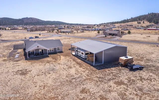 a view of a large garden with wooden fence