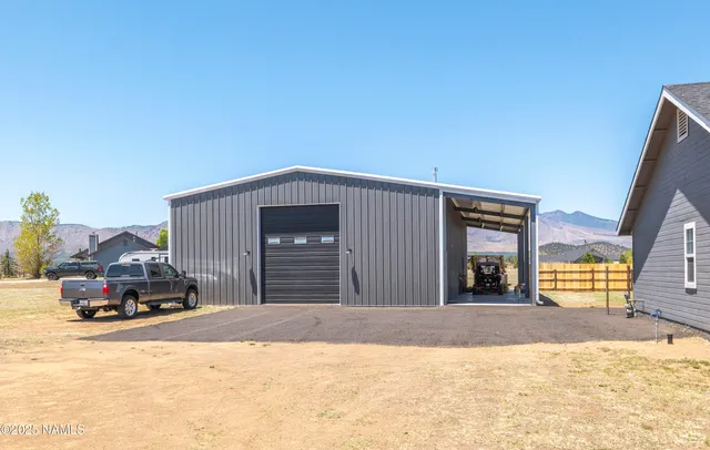 a view of a house with backyard and porch