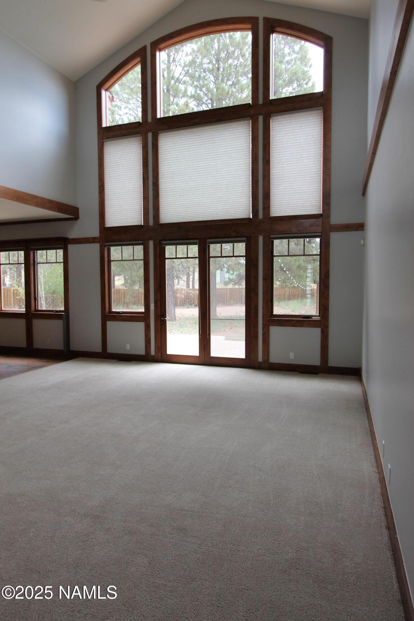 5835 Switchback Trail Flagstaff, AZ 86004 - Photo 13 of 35 a view of a big room with windows and entryway
