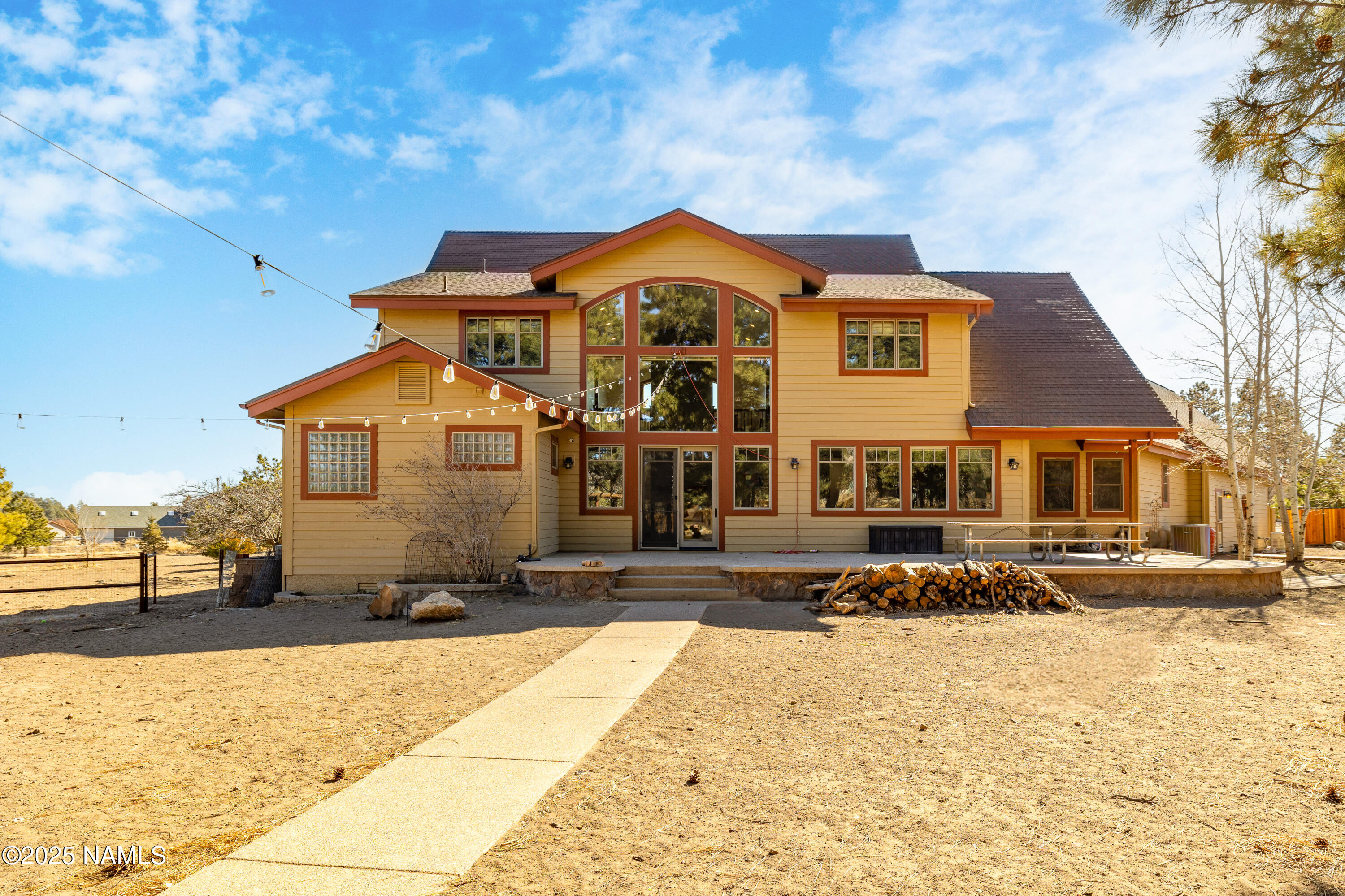 5835 Switchback Trail Flagstaff, AZ 86004 - Photo 2 of 35 a front view of a house with a yard