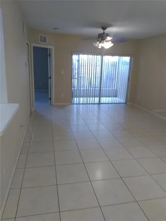 a view of an empty room with a window
