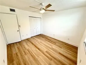 wooden floor in a hall with an entryway