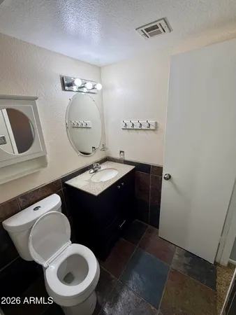 a bathroom with a toilet a sink and a bathtub