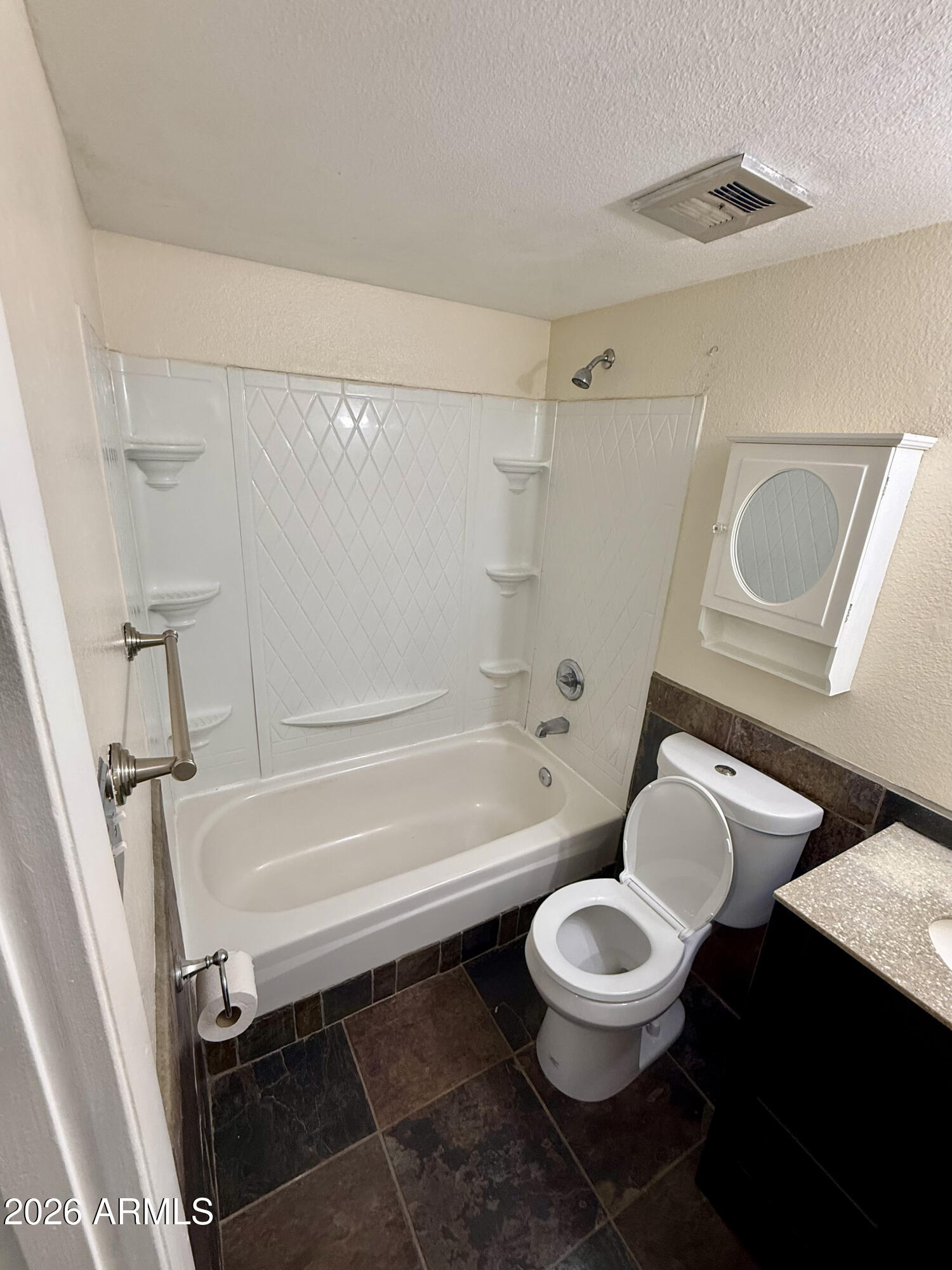 600 South Dobson Road, Unit 111 Mesa, AZ 85202 - Photo 18 of 24 a bathroom with a toilet a sink and a bathtub