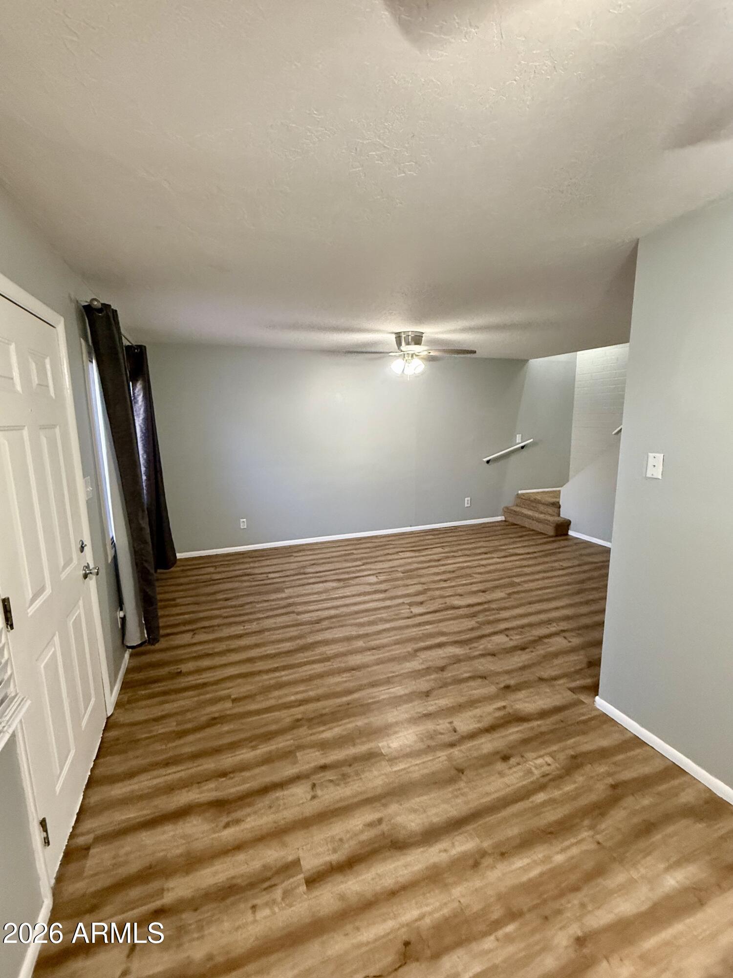 600 South Dobson Road, Unit 111 Mesa, AZ 85202 - Photo 8 of 24 a view of a room with wooden floor