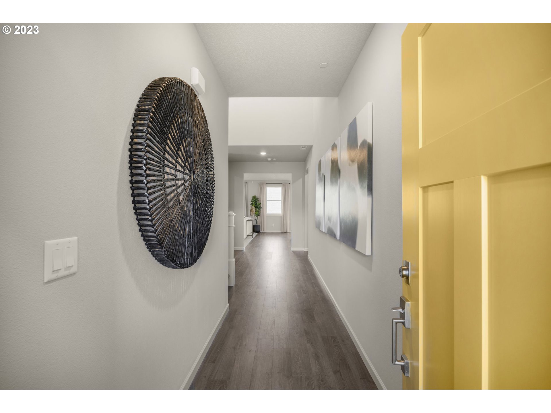 2705 South 7th Circle Ridgefield, WA 98642 - Photo 4 of 33 a view of a hallway with wooden floor