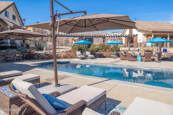 a view of a patio with swimming pool