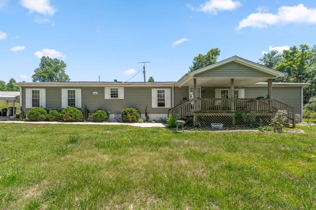 431 Mohawk Valley Road Monroe, TN 38573 - Photo 1 of 28 a front view of a house with garden