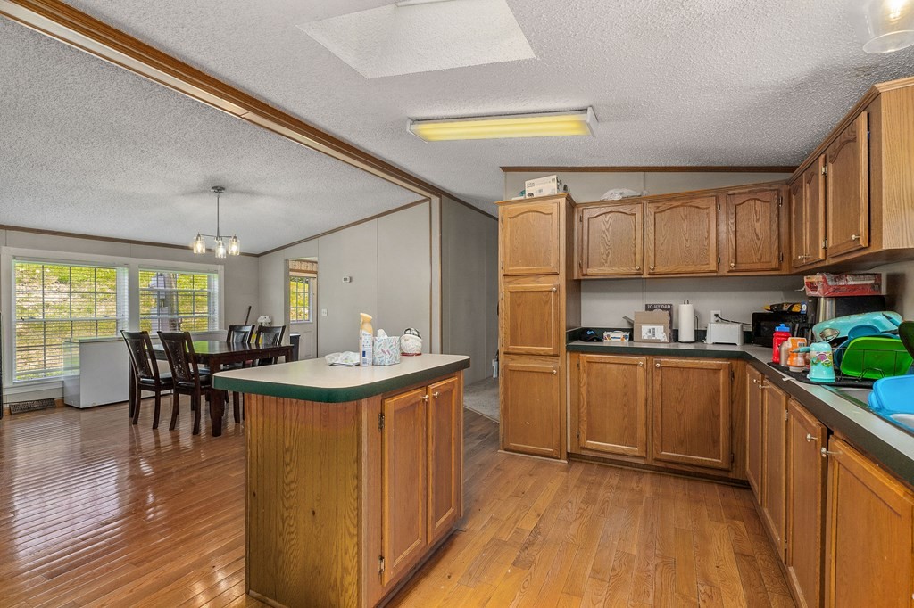 431 Mohawk Valley Road Monroe, TN 38573 - Photo 15 of 28 a kitchen with stainless steel appliances granite countertop a stove and a refrigerator