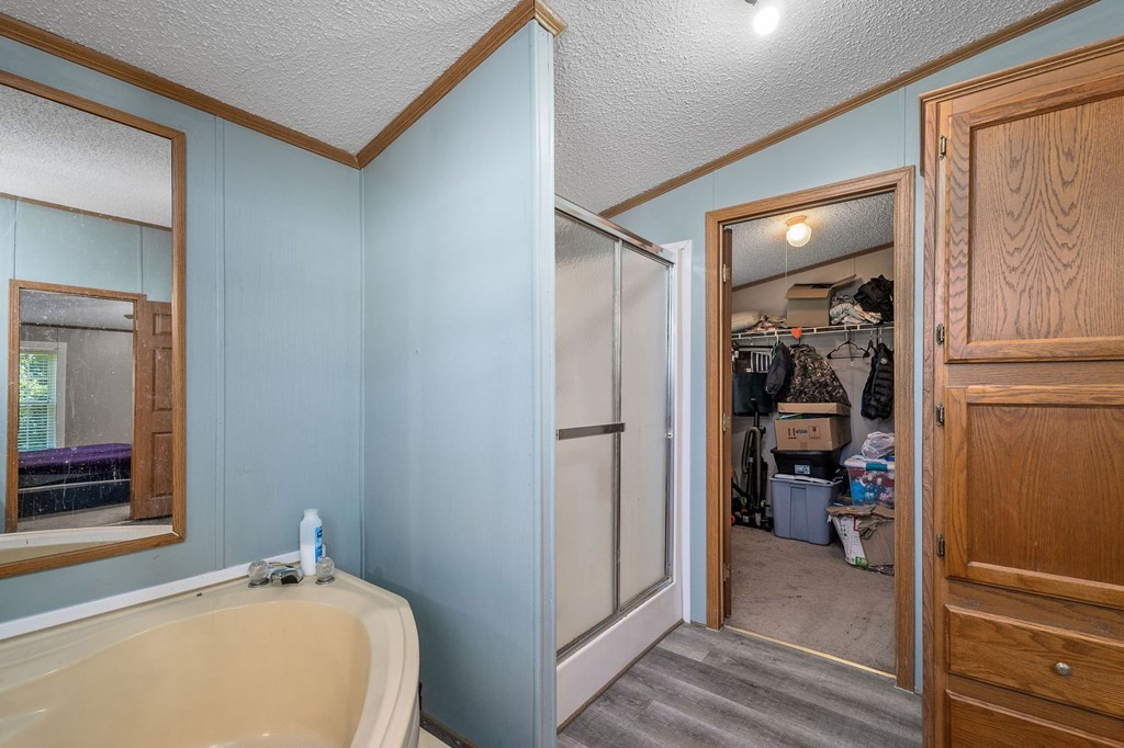 431 Mohawk Valley Road Monroe, TN 38573 - Photo 22 of 28 a bathroom with a tub and shower