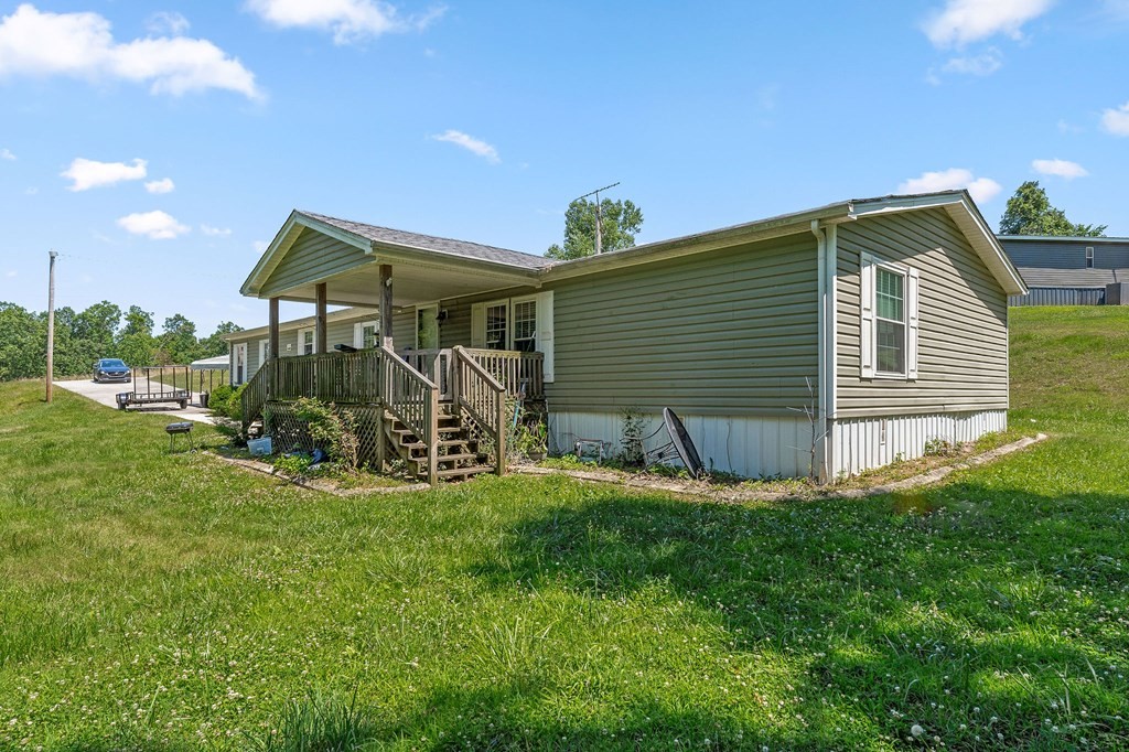 431 Mohawk Valley Road Monroe, TN 38573 - Photo 3 of 28 a view of a house with yard and sitting area