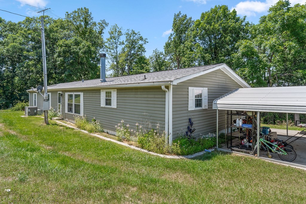 431 Mohawk Valley Road Monroe, TN 38573 - Photo 6 of 28 a view of a house with a yard chairs and table