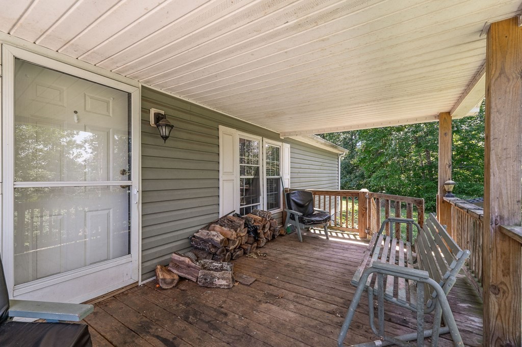 431 Mohawk Valley Road Monroe, TN 38573 - Photo 7 of 28 a view of a deck with wooden floor and outdoor seating