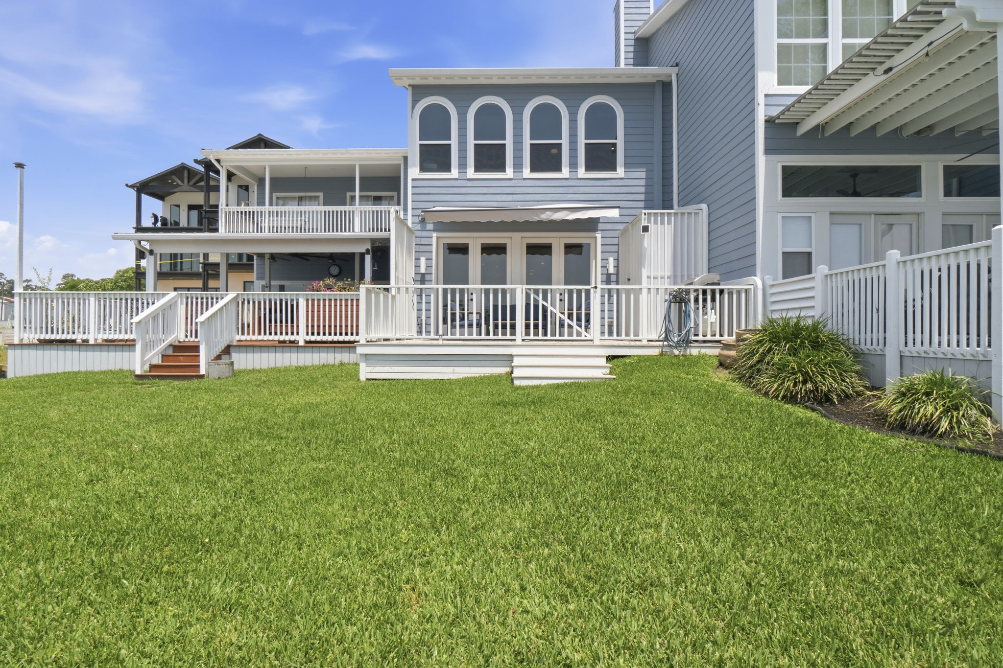 2 Key Harbour Conroe, TX 77356 - Photo 2 of 41 a front view of a house with a yard table and chairs