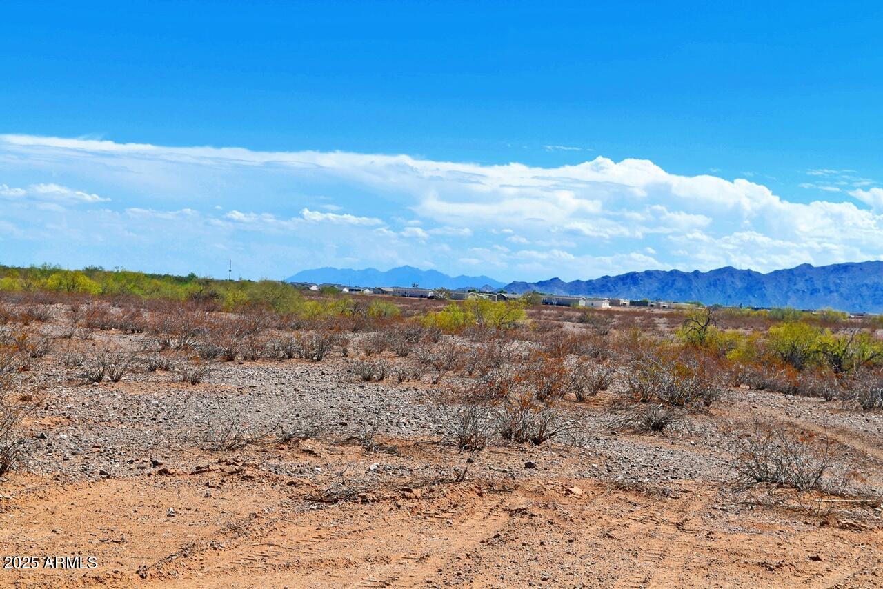 2334 West Montgomery Road, Unit 3 Wittmann, AZ 85361 - Photo 11 of 13 a view of lake with mountain in the background