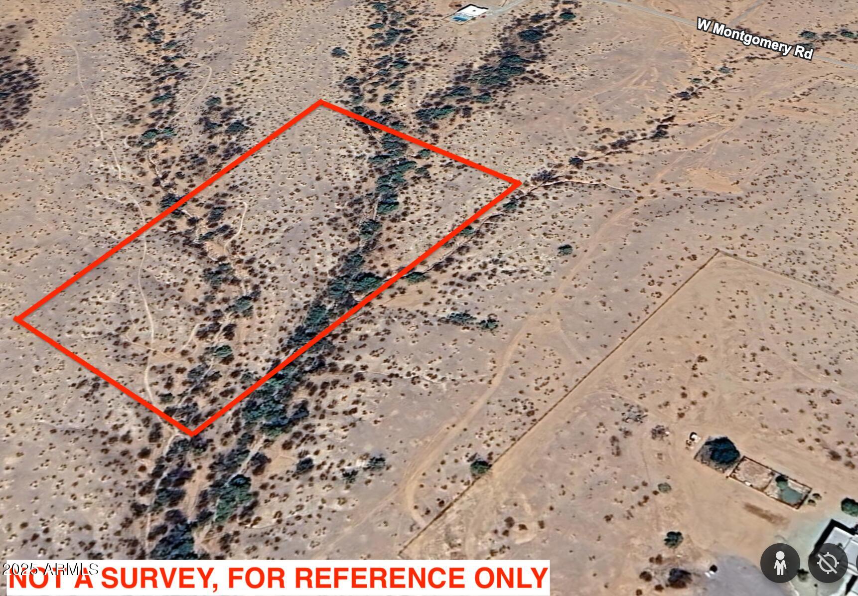 2334 West Montgomery Road, Unit 3 Wittmann, AZ 85361 - Photo 3 of 13 a view of a dry area with trees in the background