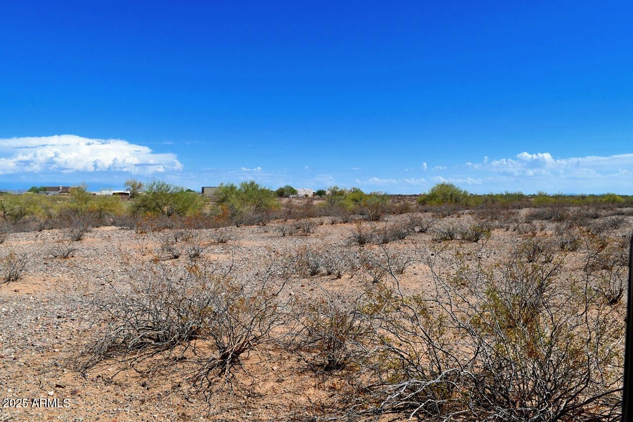 2334 West Montgomery Road, Unit 3 Wittmann, AZ 85361 - Photo 9 of 13 a view of an outdoor space and a yard