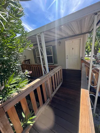 a view of porch with wooden floor and outdoor seating