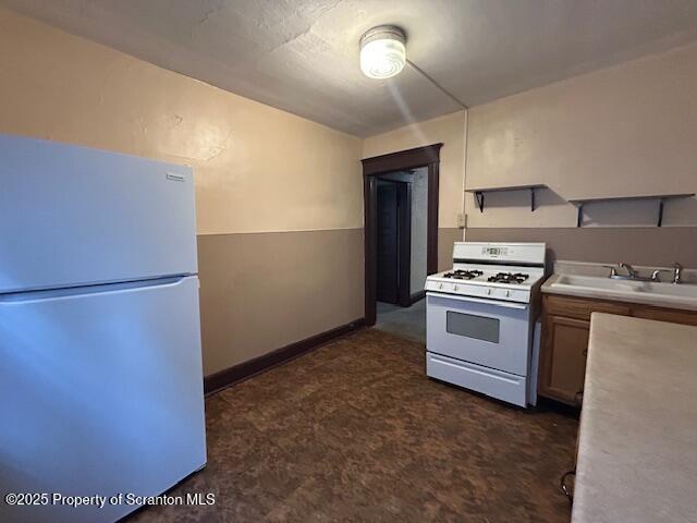 610 Moosic Street, Unit 2 Scranton, PA 18505 - Photo 18 of 18 a kitchen with refrigerator and white stove