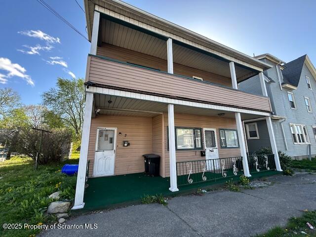 610 Moosic Street, Unit 2 Scranton, PA 18505 - Photo 2 of 18 a front view of a house with a yard