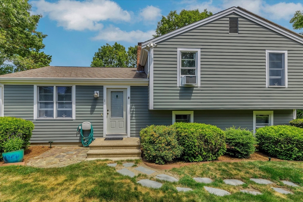 1 Sandy Lane Bourne, MA 02532 - Photo 1 of 37 a front view of a house with garden