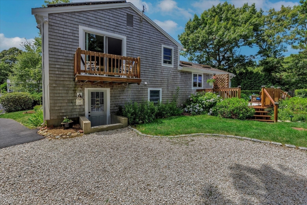 1 Sandy Lane Bourne, MA 02532 - Photo 31 of 37 a front view of a house with garden