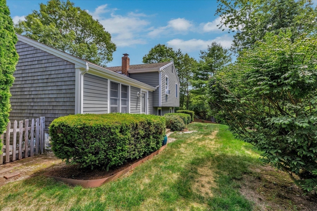 1 Sandy Lane Bourne, MA 02532 - Photo 34 of 37 a view of a backyard with plants