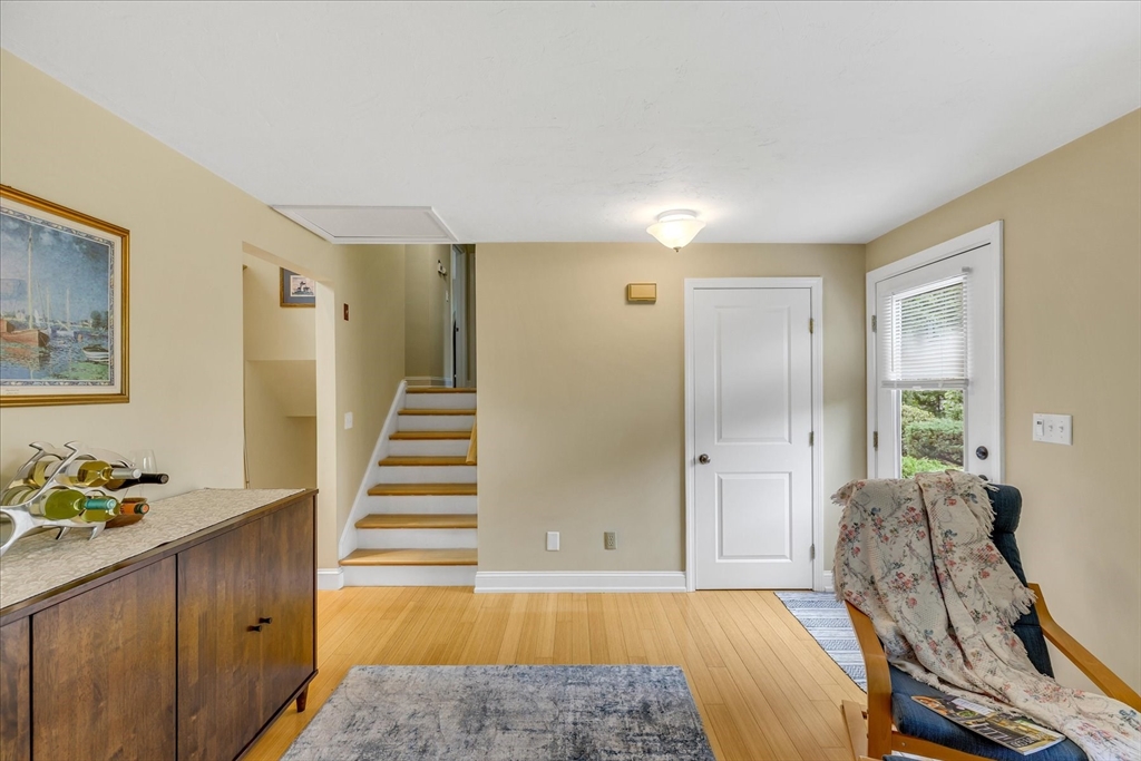 1 Sandy Lane Bourne, MA 02532 - Photo 8 of 37 a view of a livingroom with wooden floor and furniture