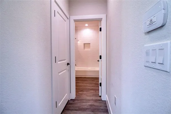 a view of a bathroom from a hallway