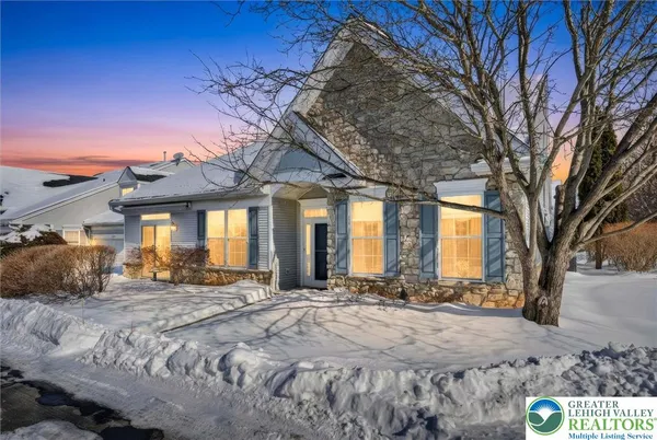 a view of a house with large windows