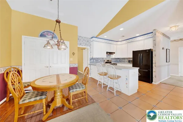 a very nice looking dining room with a table and chairs