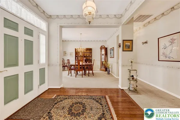 a view of a livingroom with furniture wooden floor and a rug
